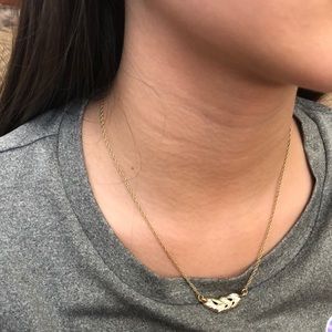 Gold feather necklace
